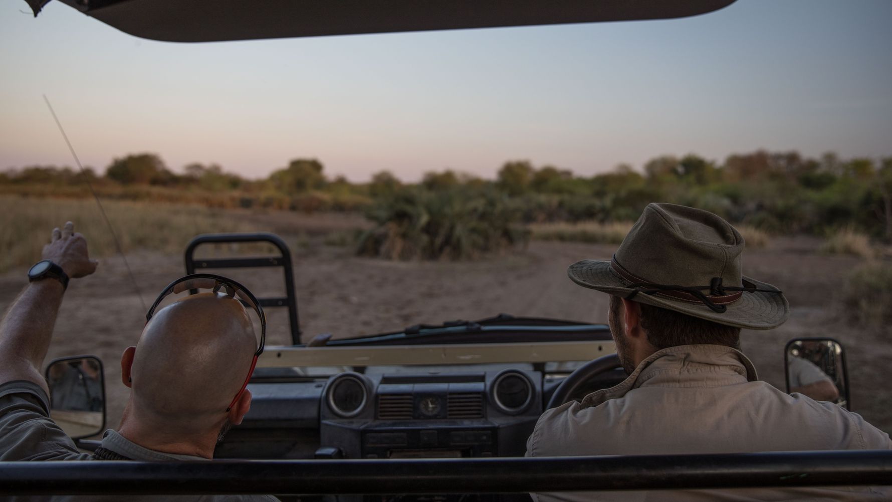 Field guide training Africa: field guide student and his instructor on a game drive in Southern Africa