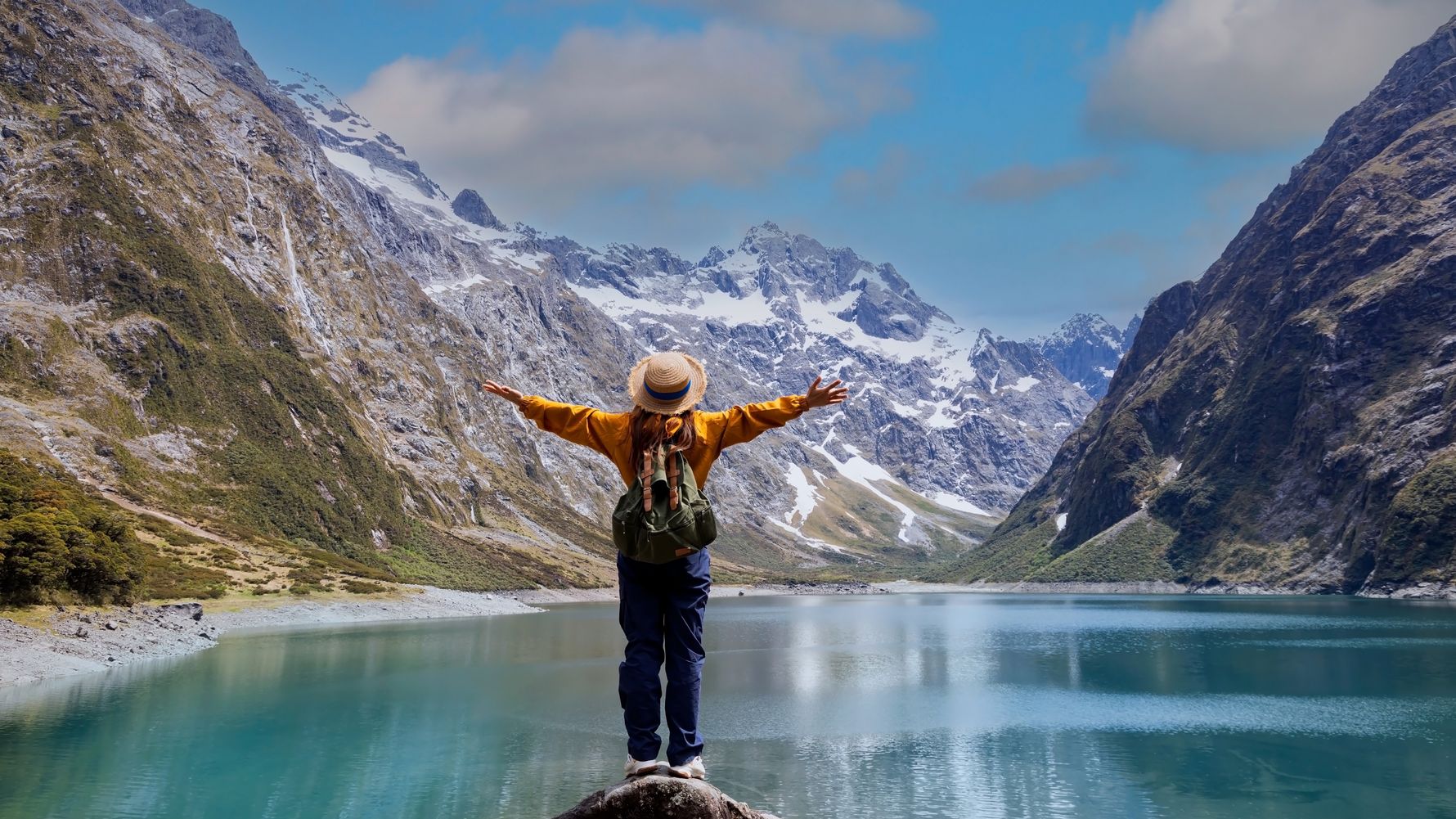 Woman in front of lake