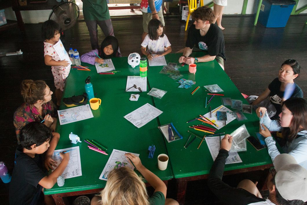 Children draw pictures with turtles