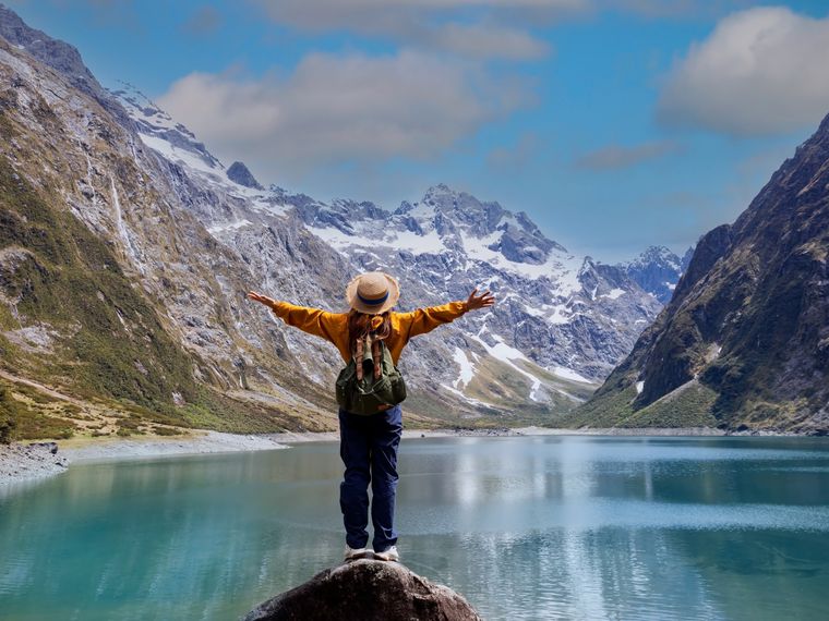 Woman in front of lake