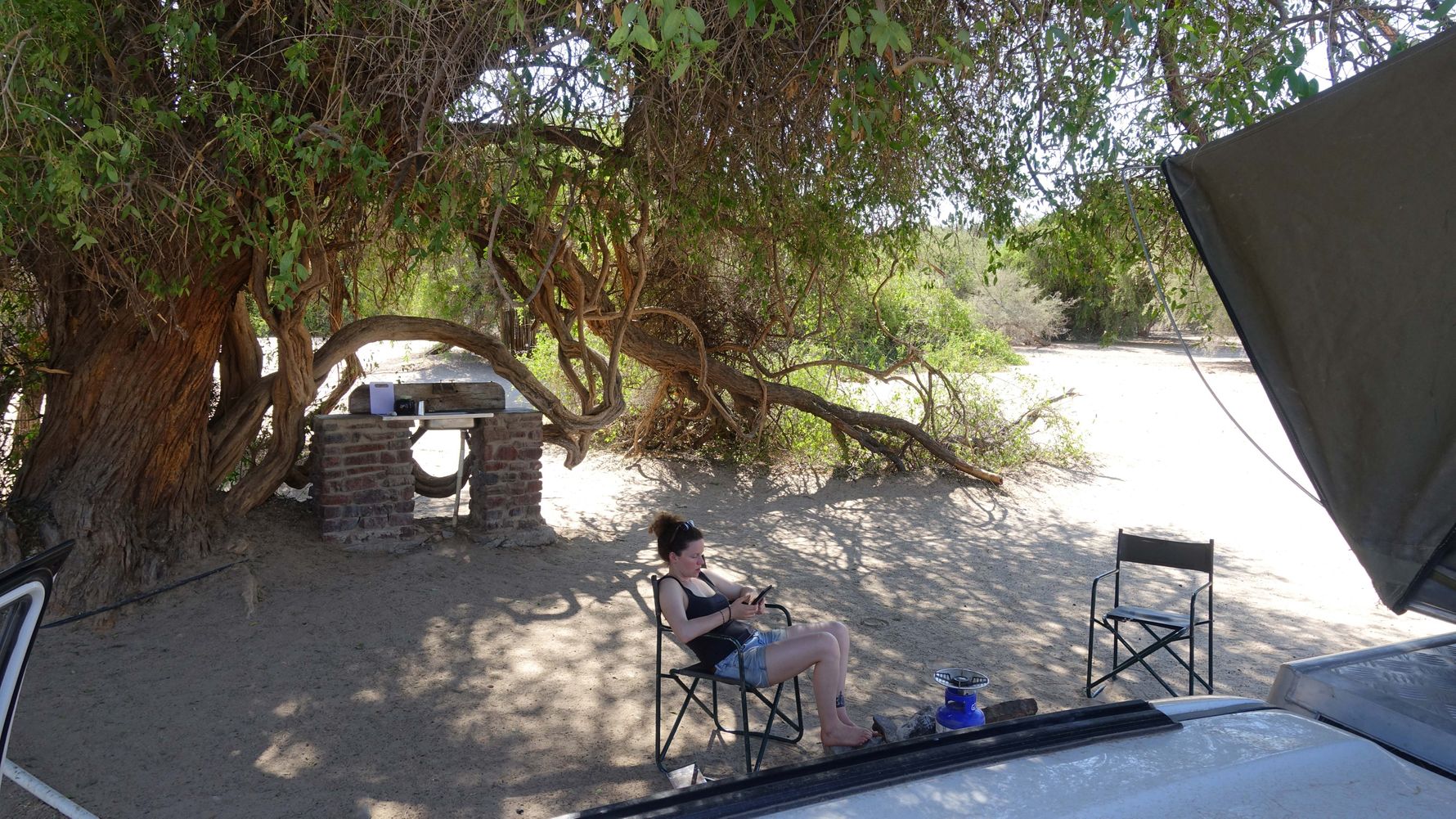 Safari accommodation Africa: looking out of a rooftop tent on the surrounding area in Namibia