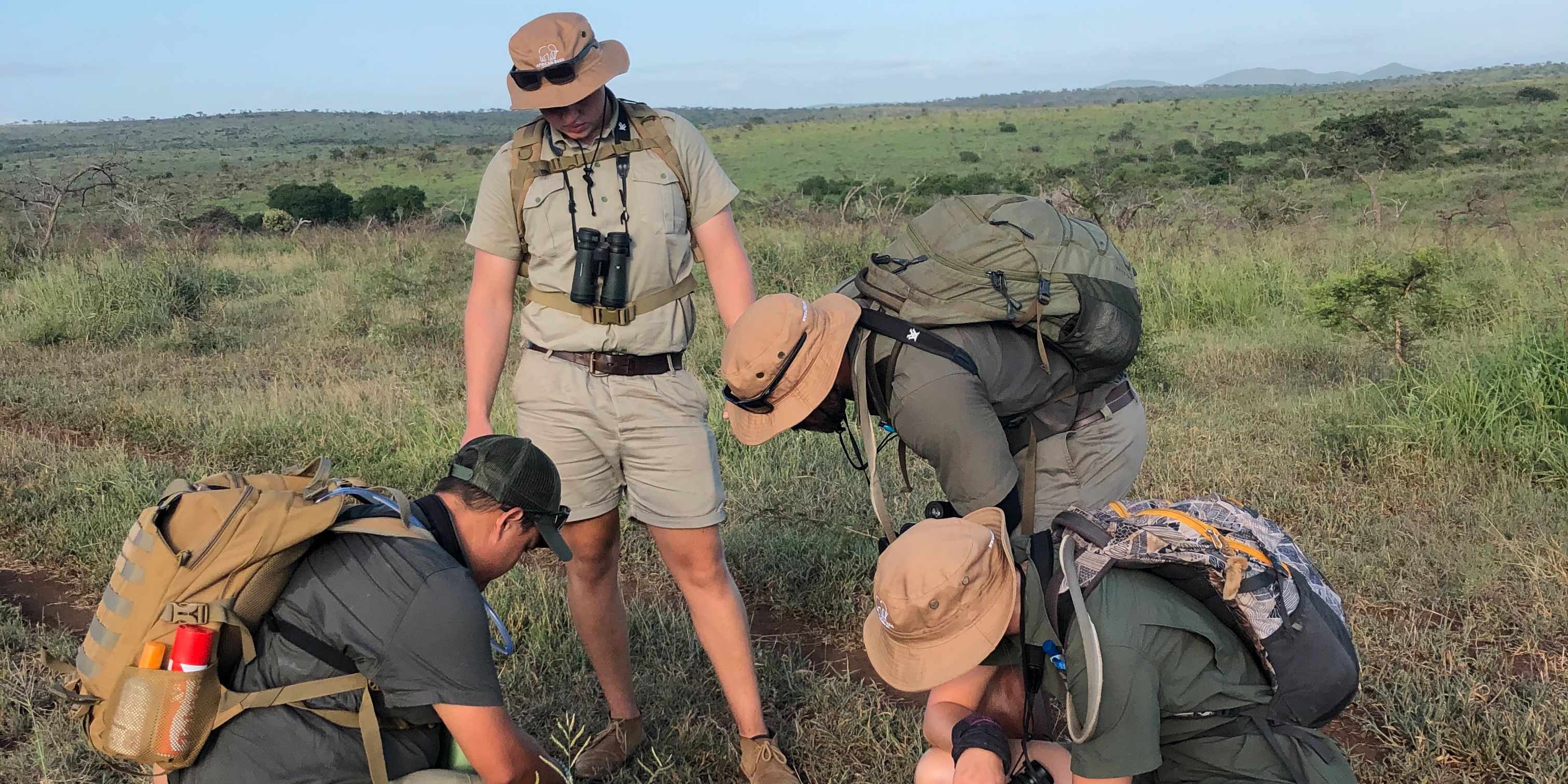 Guide students in Southern Africa learning to read animal tracks