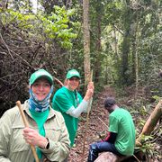 Group trekks in the forest