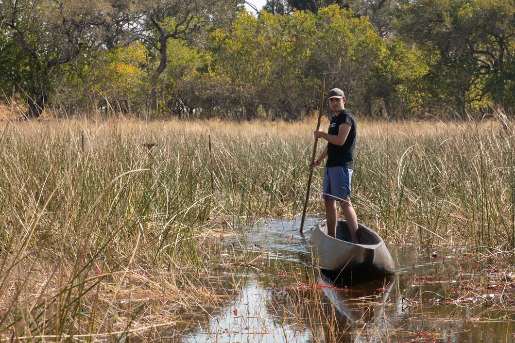 Man in mokoro in Botswana