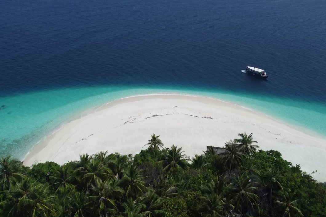natucate-pwe-maldives-beach-aerial