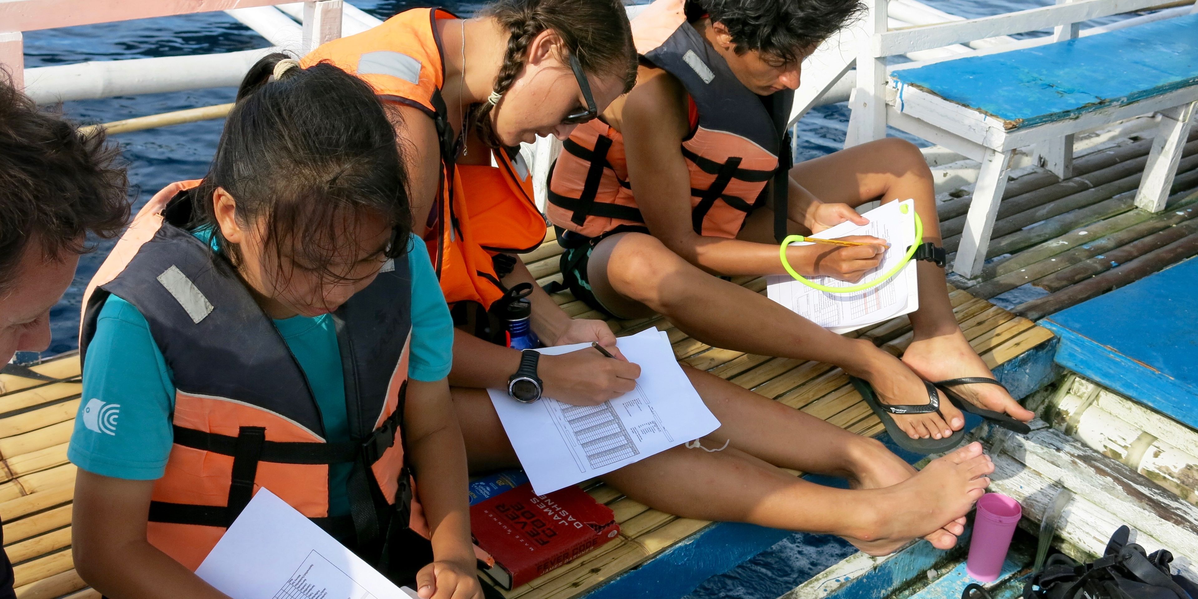 Volunteers in the Philippines are collecting data after a dive