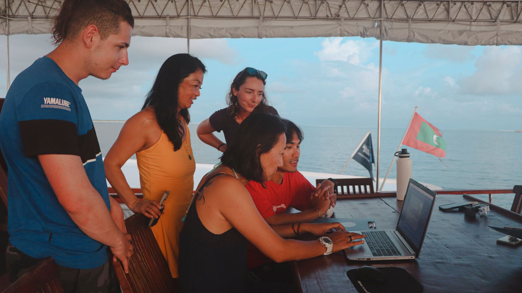 Group of researchers checks data on a laptop