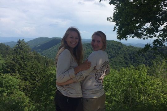 Two volunteers in North Carolina are standing in the midst of the US state's natural landscape