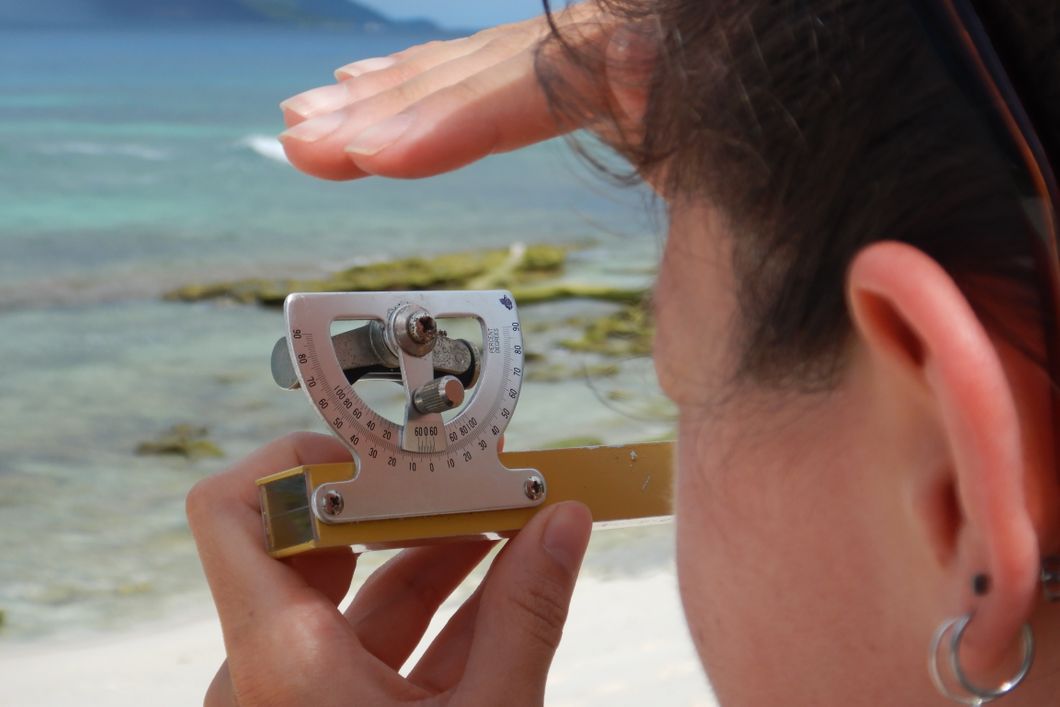 A volunteer in our species conservation project in the Seychelles is working on the beach