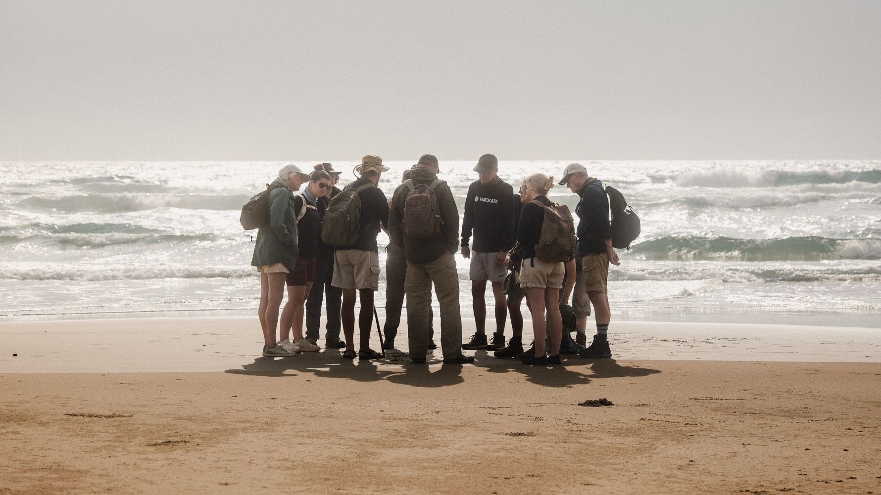 Group standing together at the beach in South Africa