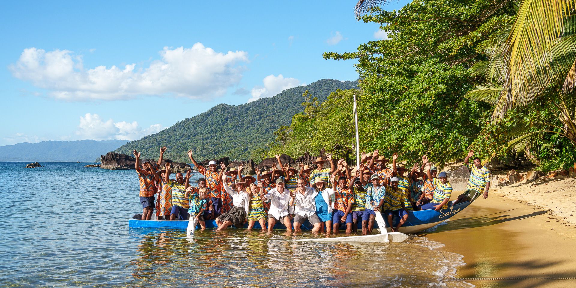 Group pictures on the beach with the boat