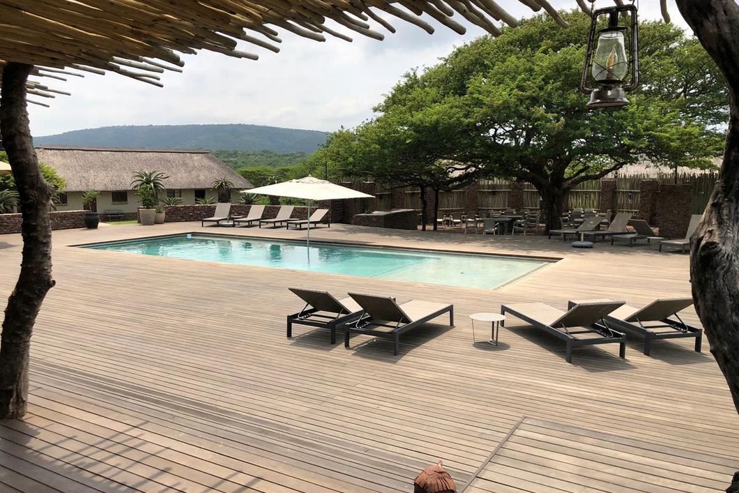 Looking over the swimming pool of a lodge in South Africa which serves as accommodation for the game ranger short course
