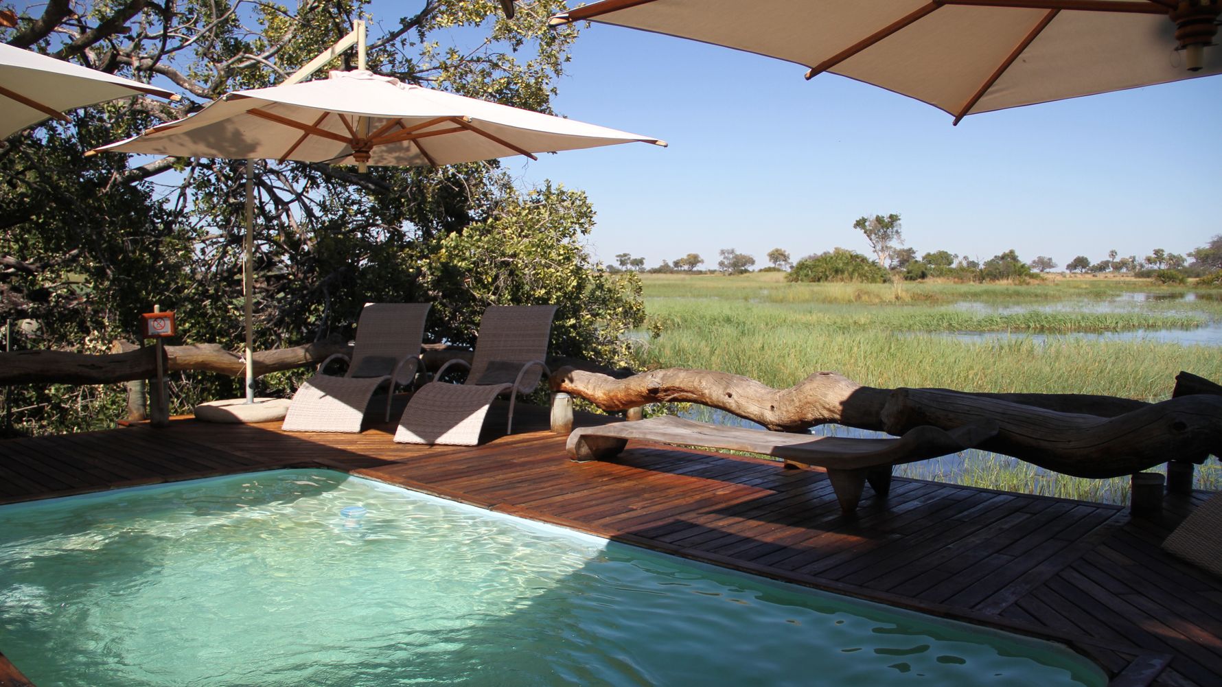 Swimming pool with chairs of a safari lodge in Southern Africa