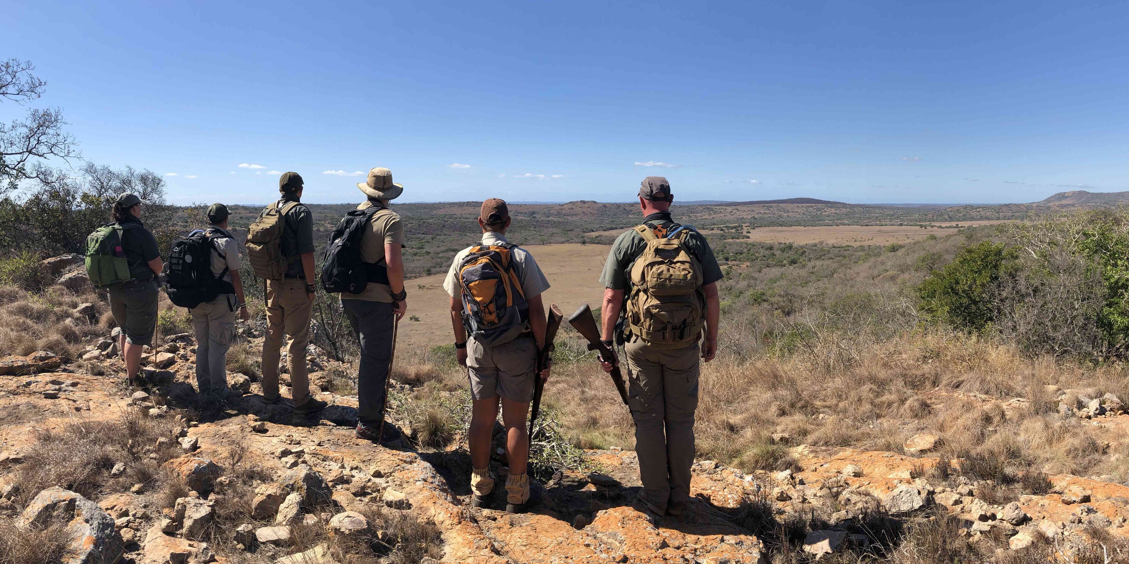 Course students of the game ranger short course on a bush walk in Southern Africa
