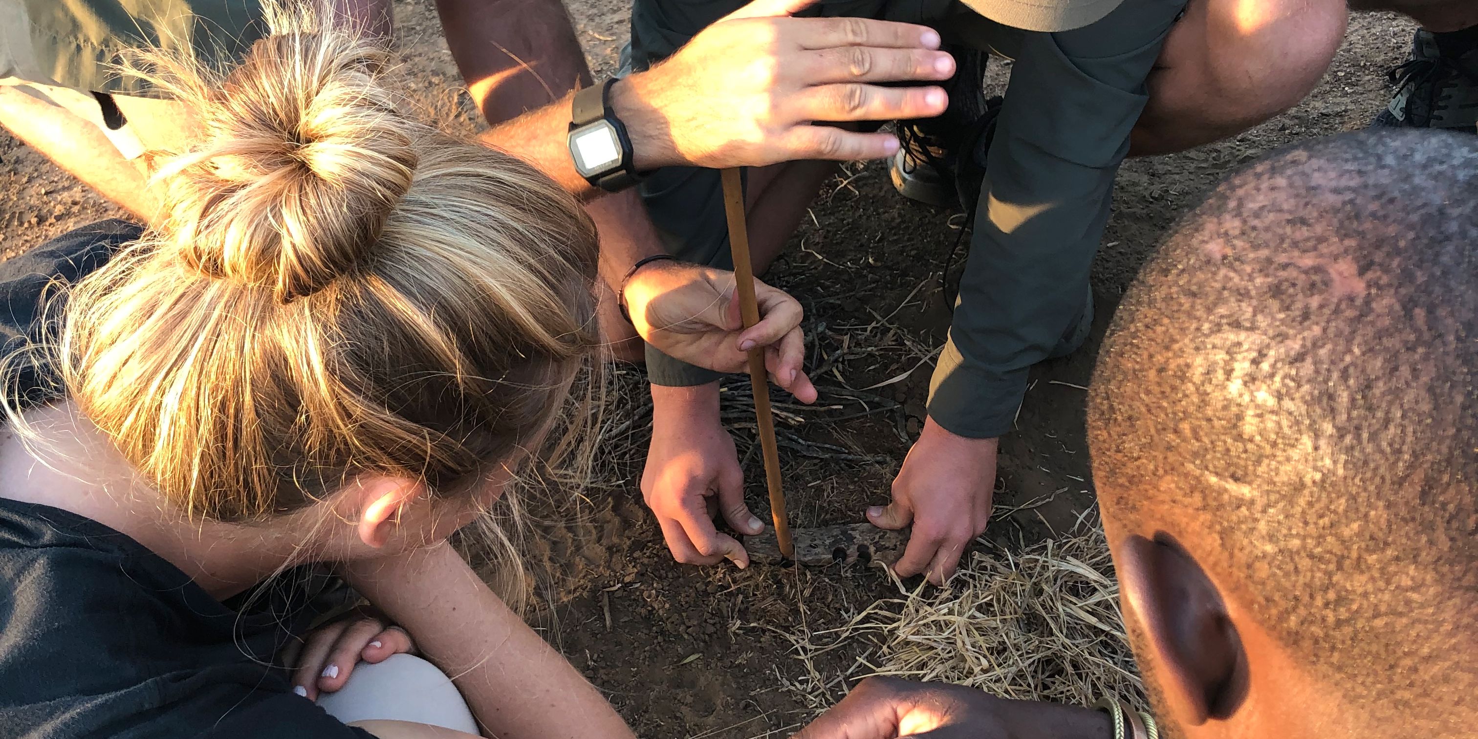 Course students of the game ranger short course in Southern Africa making a fire